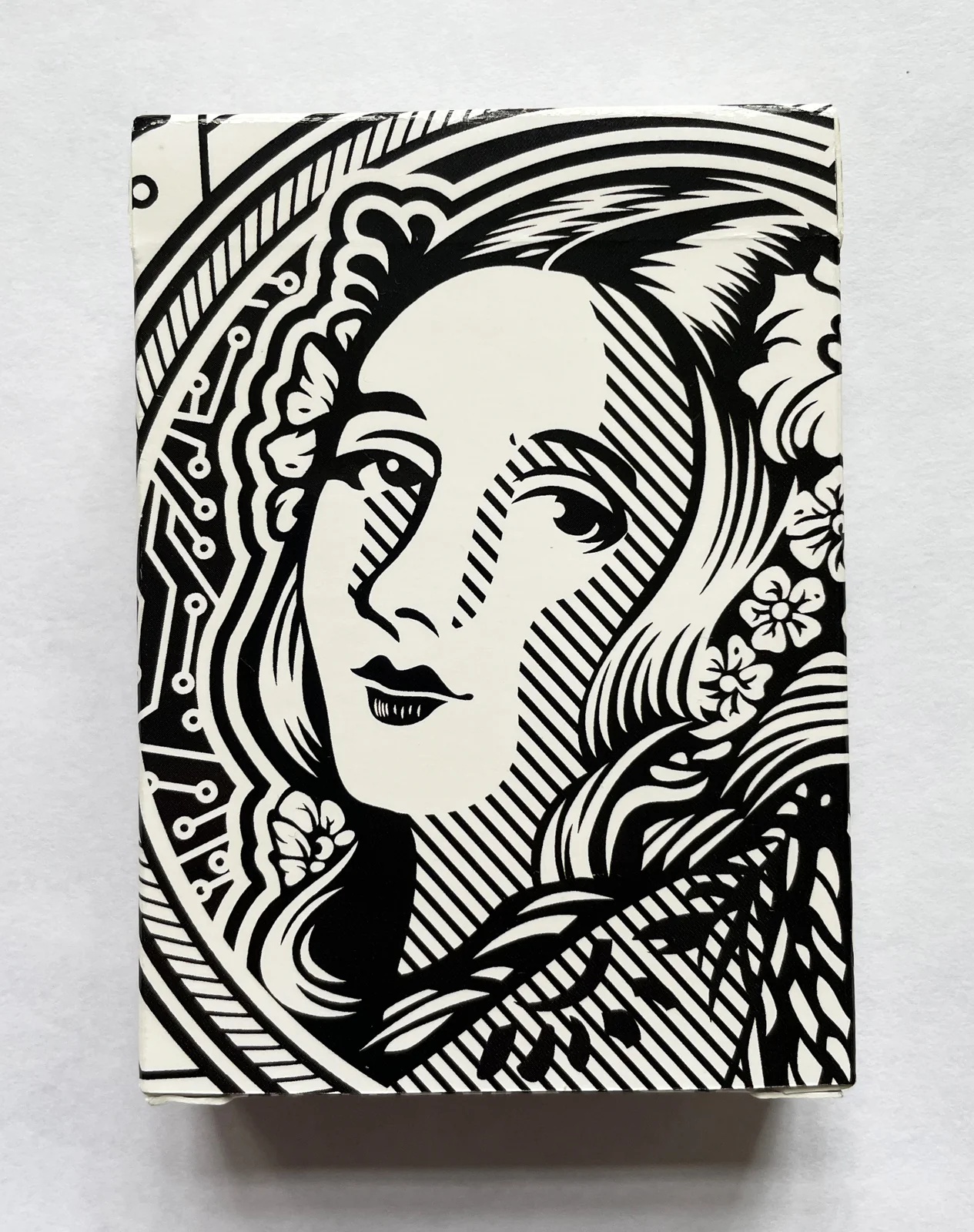 Close view of the black-and-white illustrated playing-card box.
