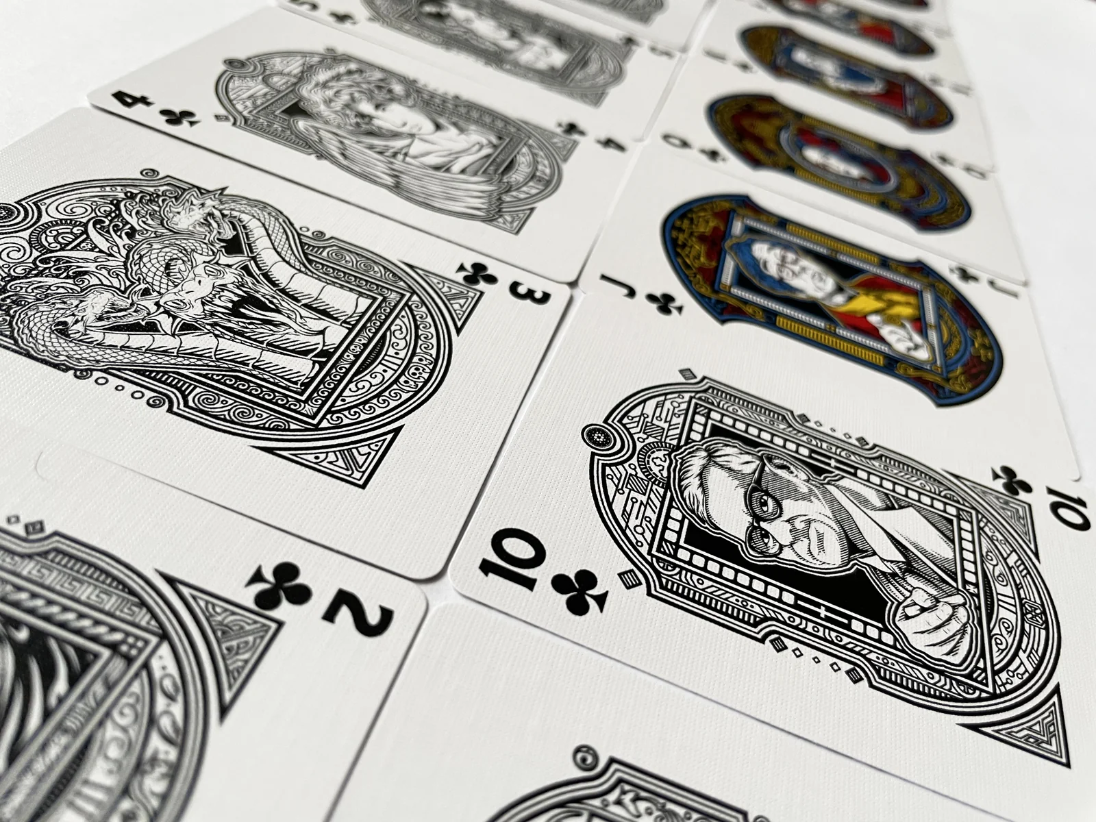 Illustrated Clubs playing cards arranged together.