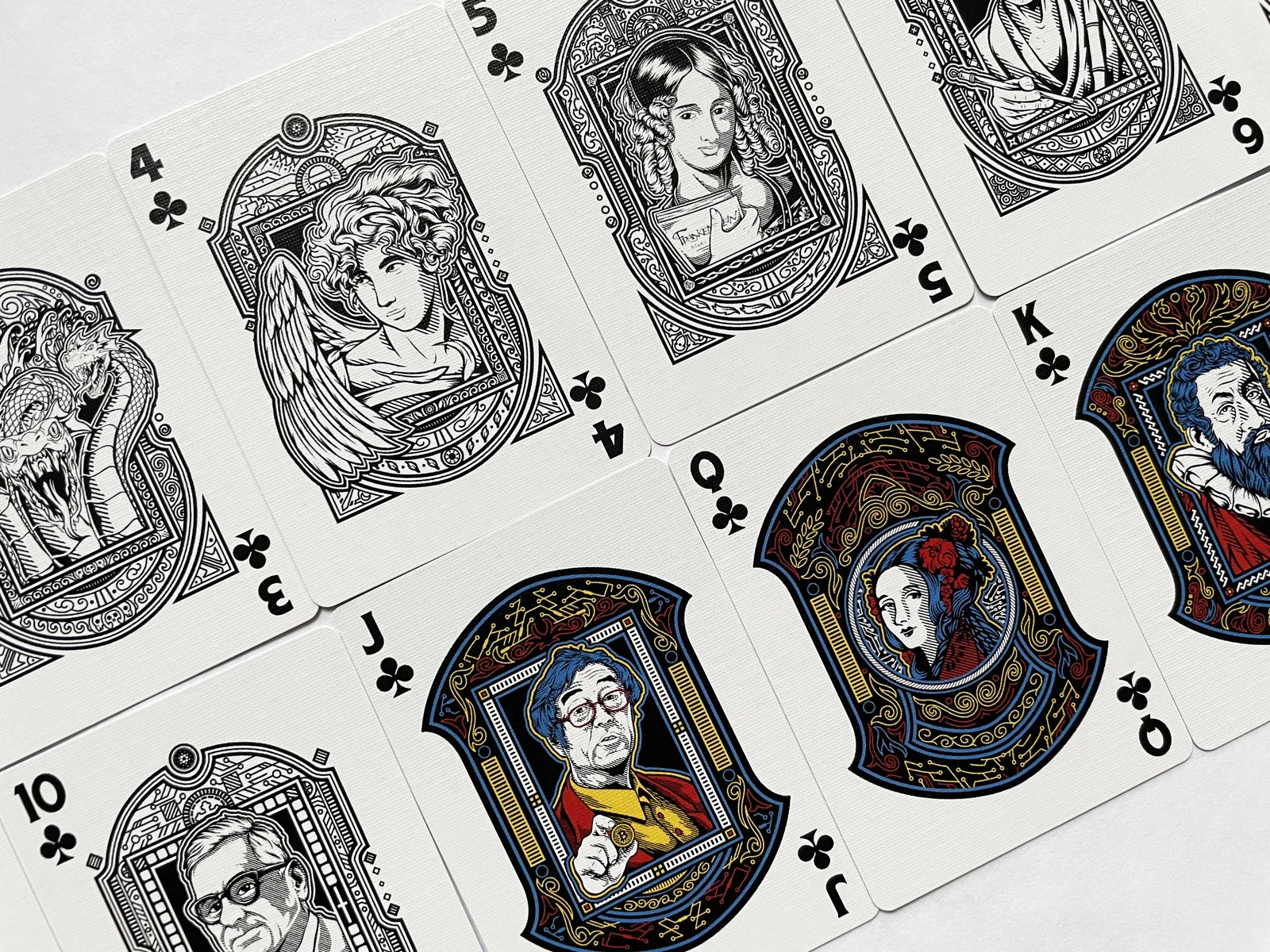 Spread of illustrated court and number cards.